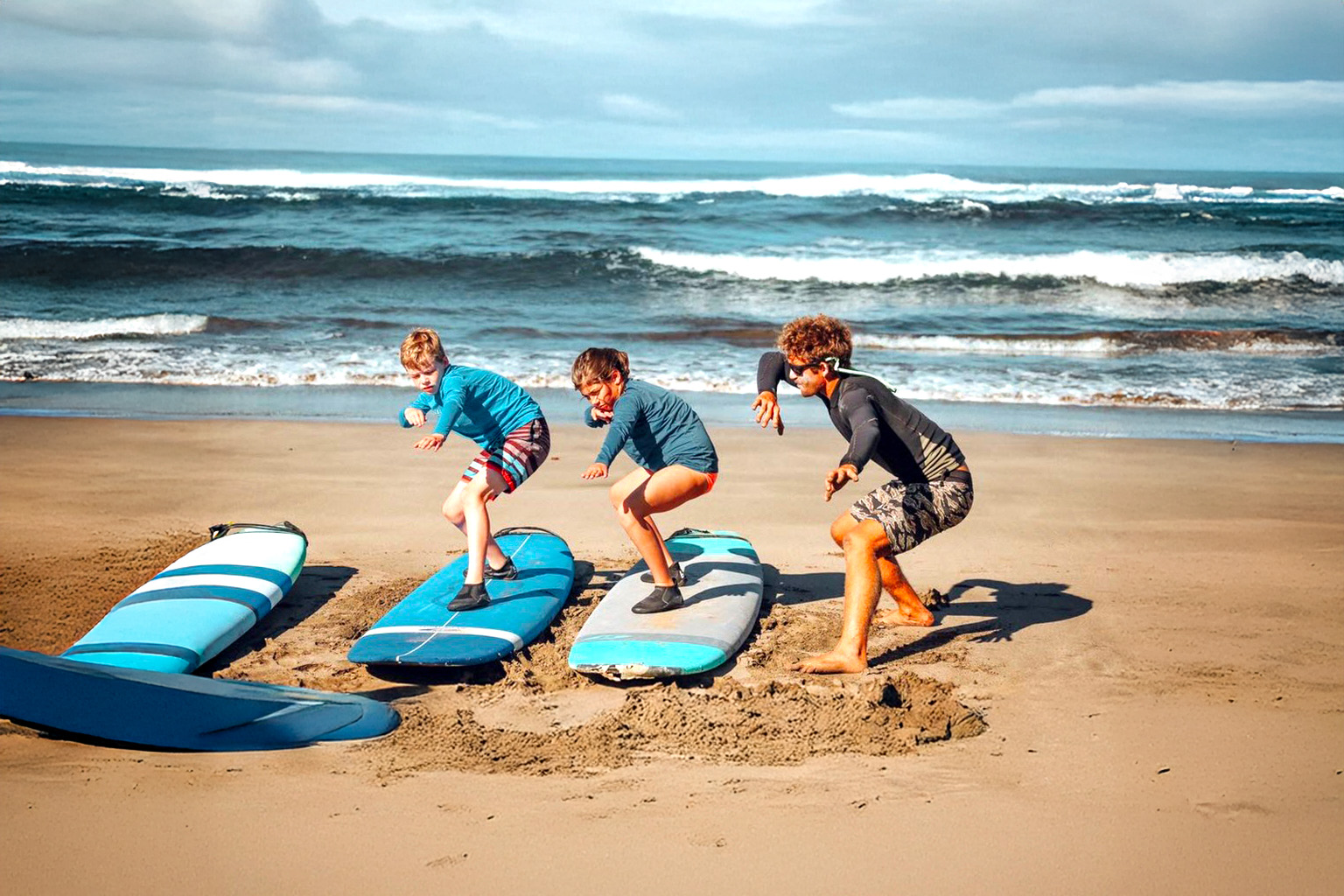Surfers riding waves